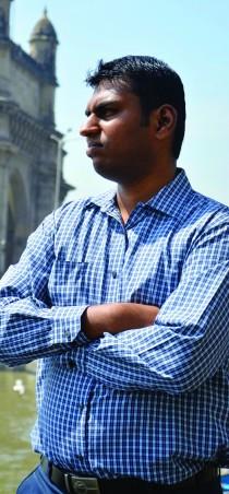 Vishal Chaudhari, founder of Wingage, stands at the Gateway of India. (Photo: Sierra Bein)