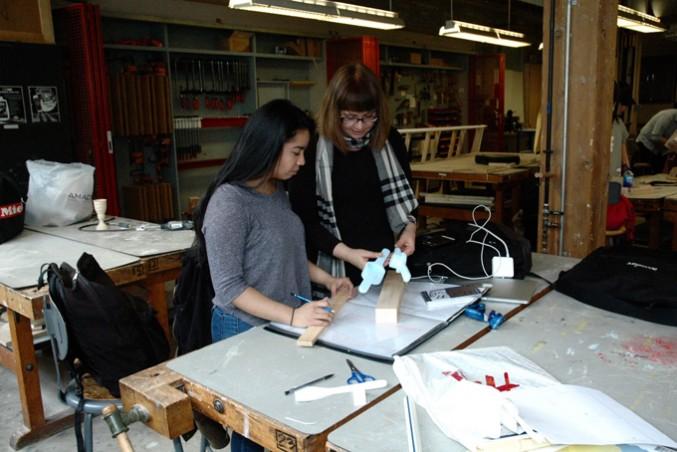 Lorella Di Cintio helping first-year student Lori Fernandez with final utensil project. PHOTO: KAROUN CHAHINIAN