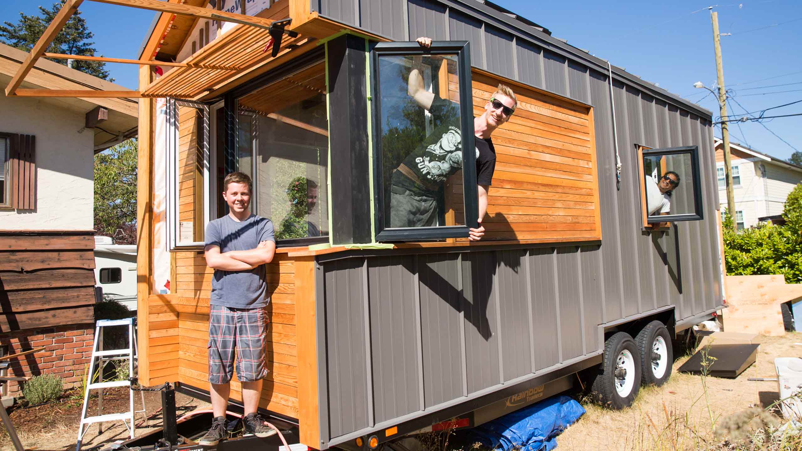 From left: Douglas Peterson-Hui, Daniel Sobieraj and Gregorio Jimenez with their completed tiny home. PHOTO COURTESY JACOB ZINN