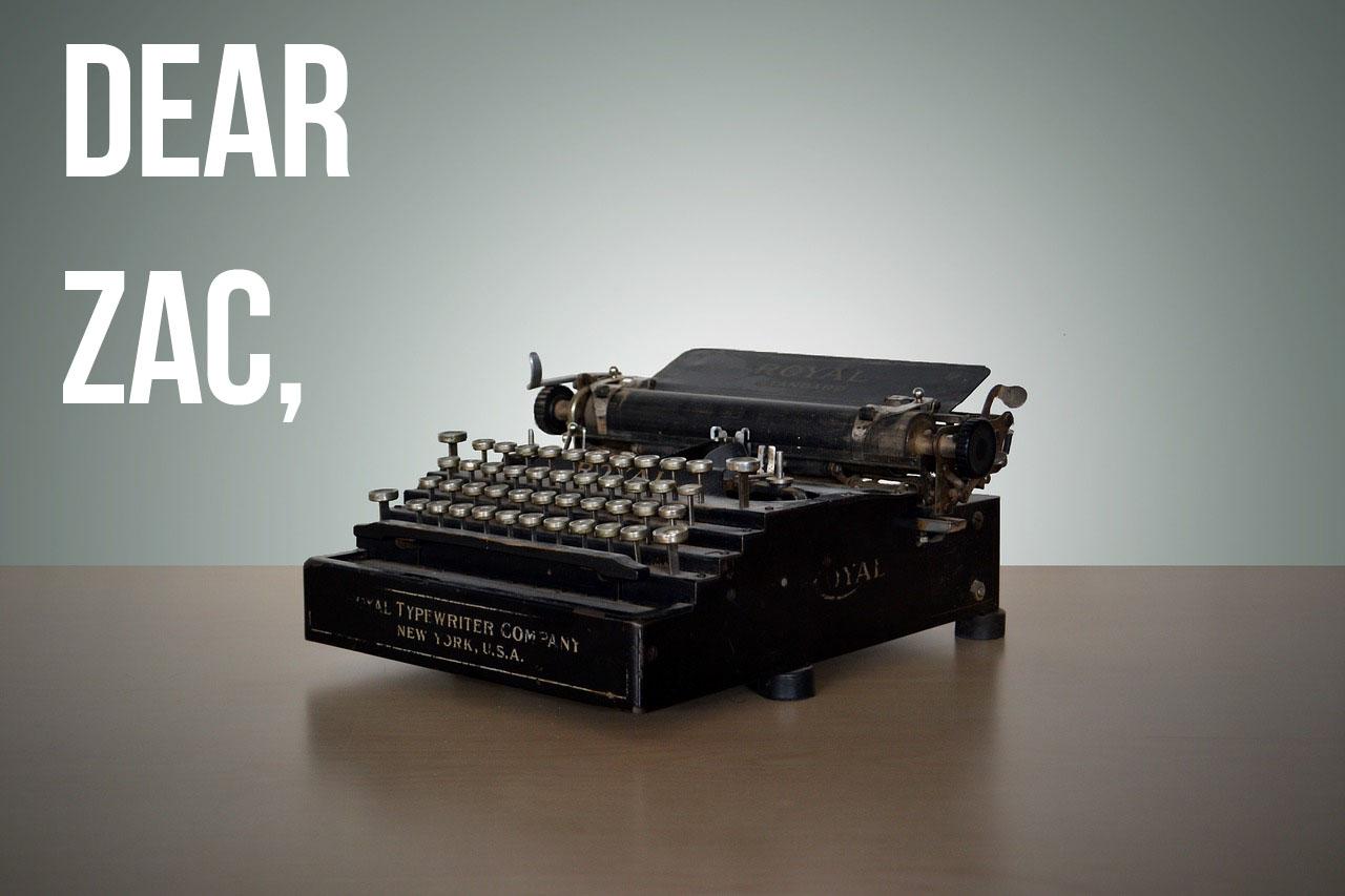 A typewriter with the words "Dear Zac" hovering beside it