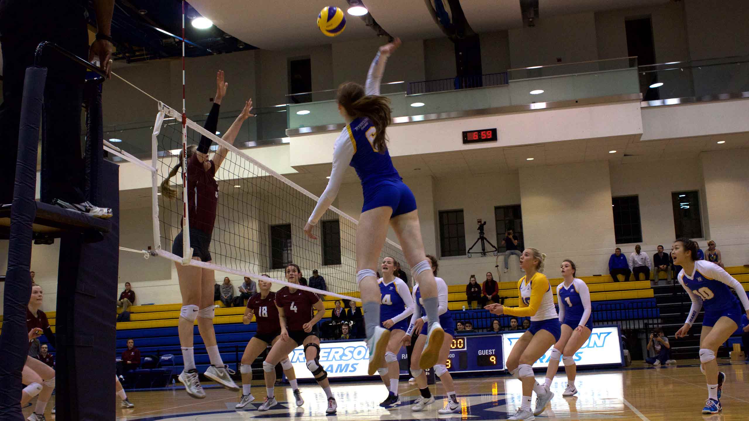 A rams volleyball player goes for a strike