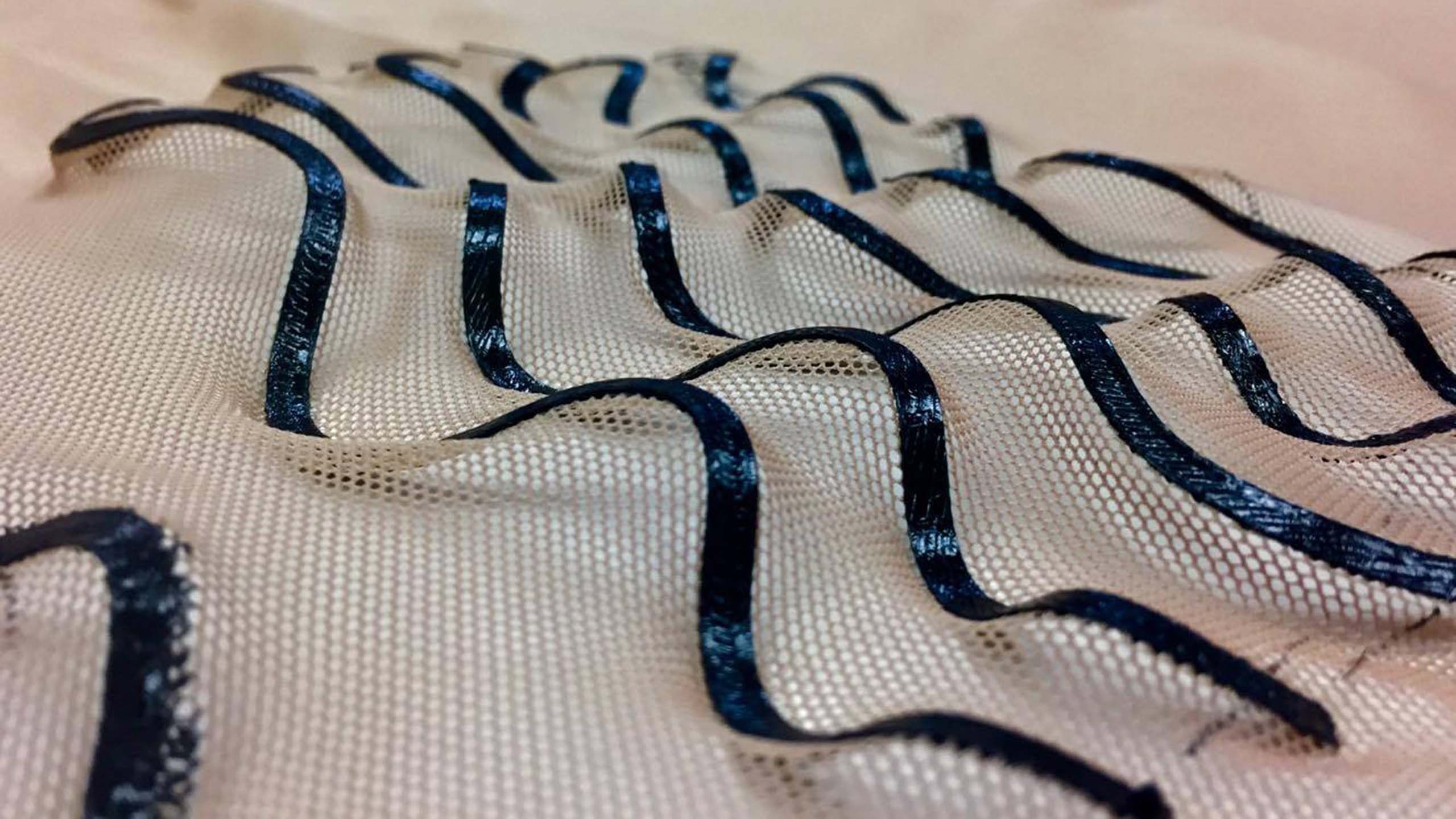 White 3d-printed fabric with black wavy stripes