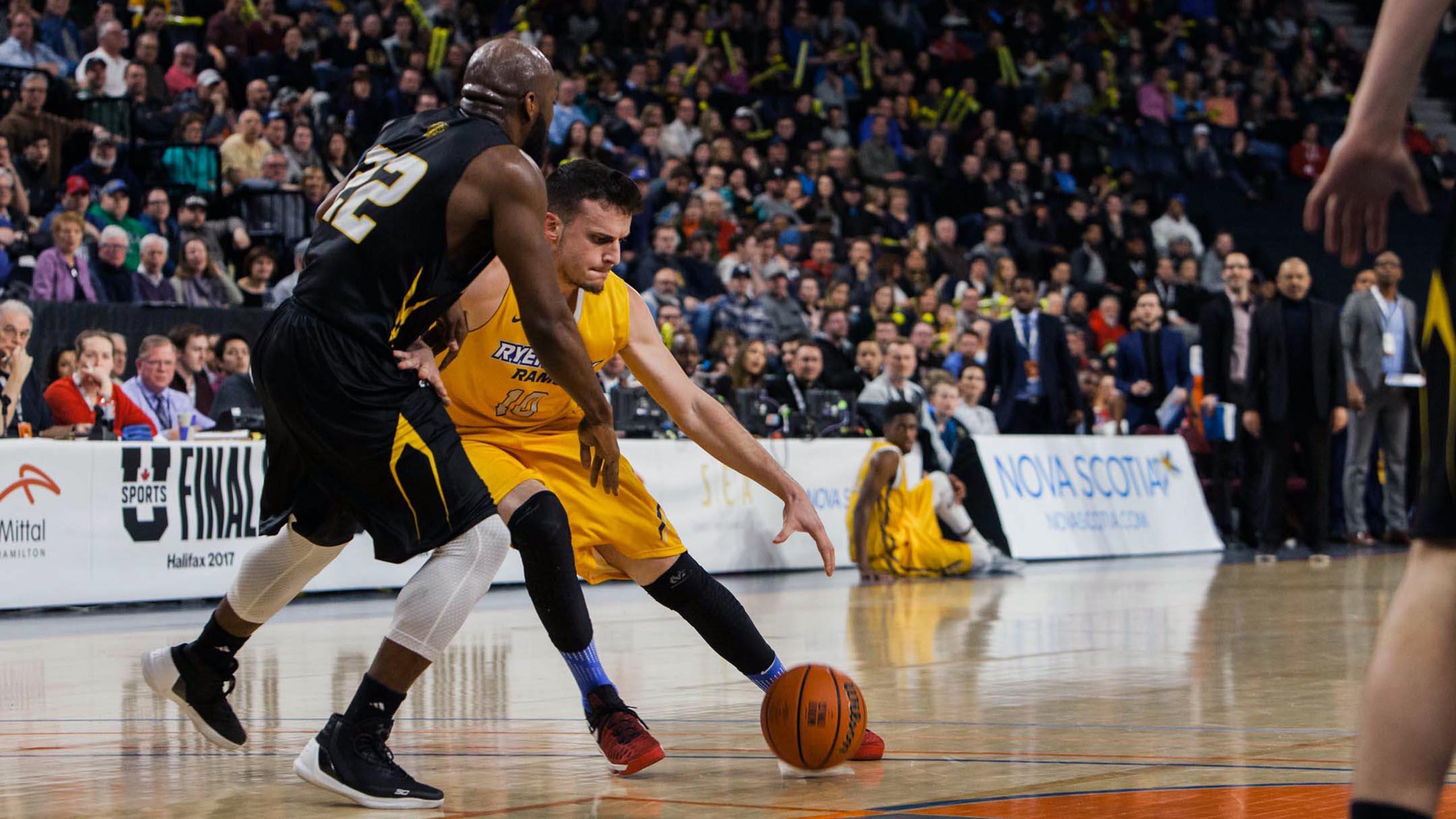 A Ryerson player battles it out on the court against a Dalhousie player, at the March 11 semifinals