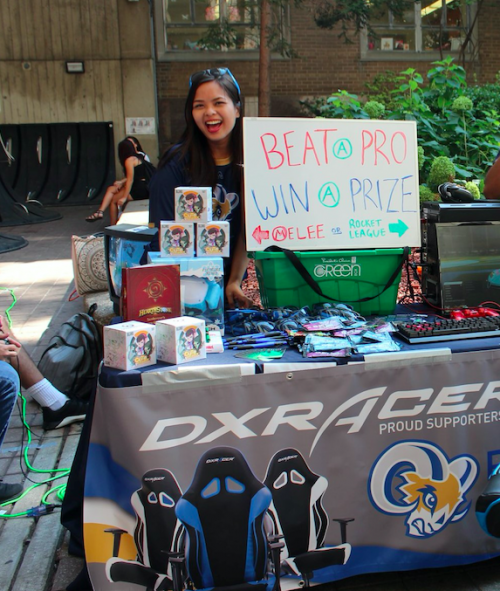 Woman standing in front of ESports table on a club day