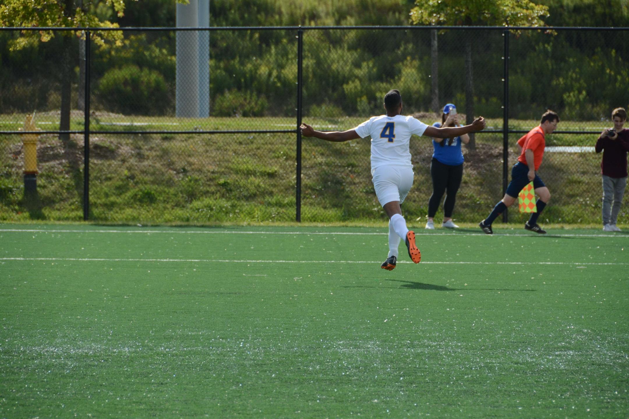 A photo of a male Ryerson student playing soccer
