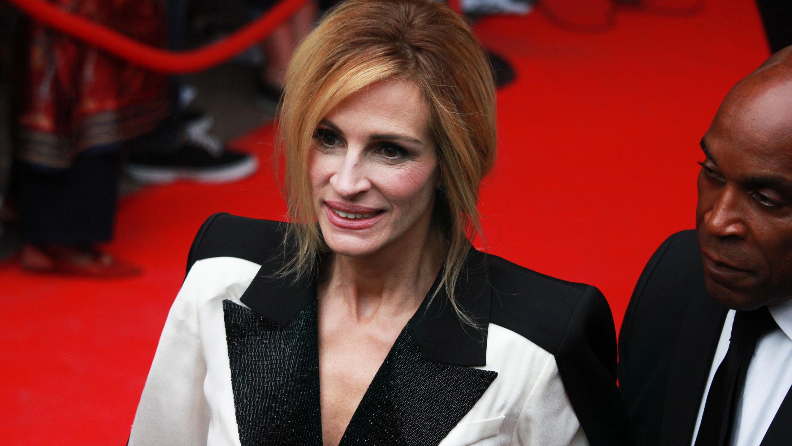 Julia Roberts smiles on red carpet at movie premiere