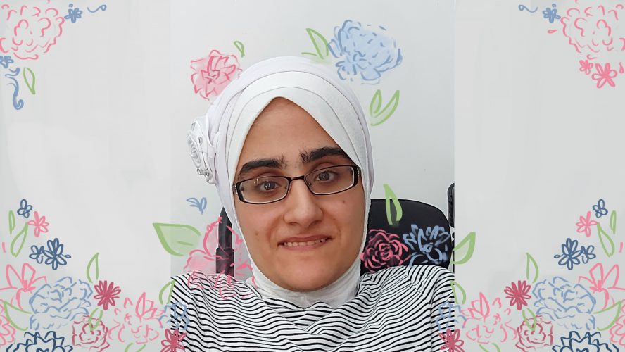 Alyass is wearing a white hijab, glasses while sitting on her wheelchair. The picture has several colourful flowers doodled onto it.