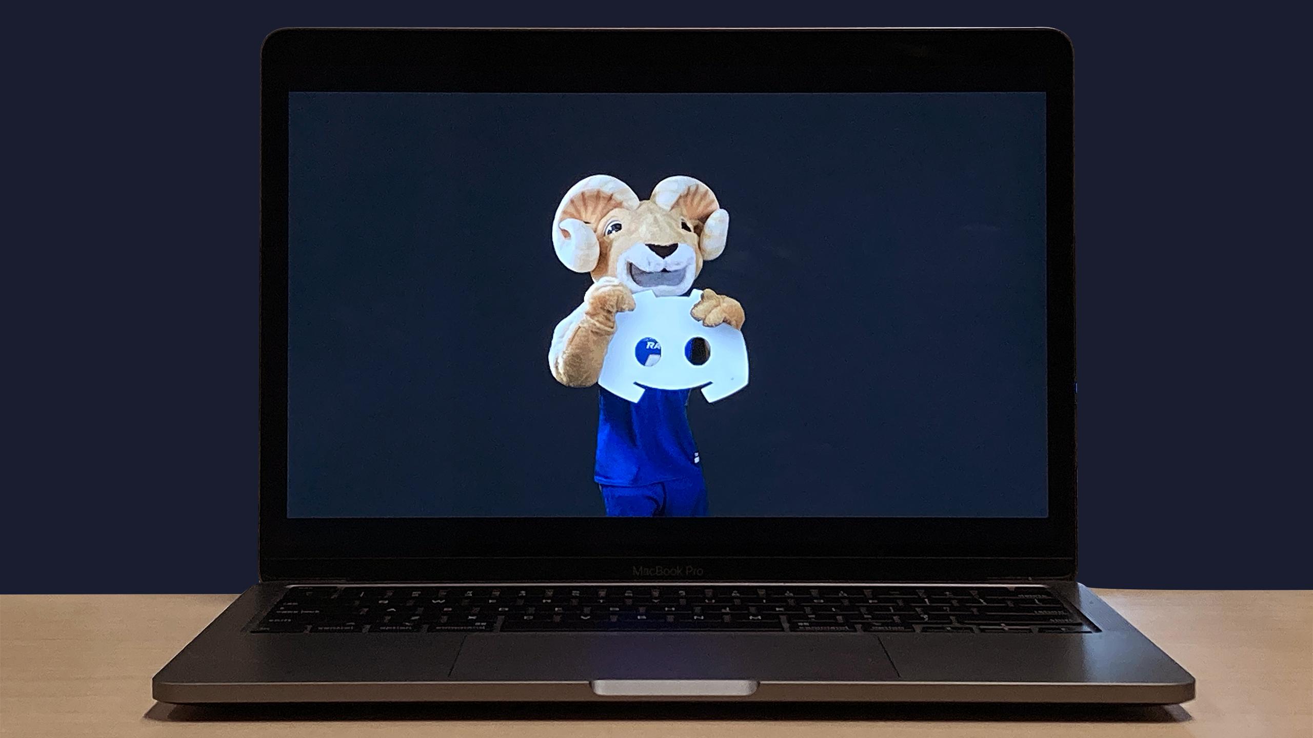 A laptop showing Eggy the Ram holding the Discord logo