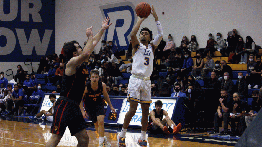 A Rams men's basketball player gathers for a jump shot