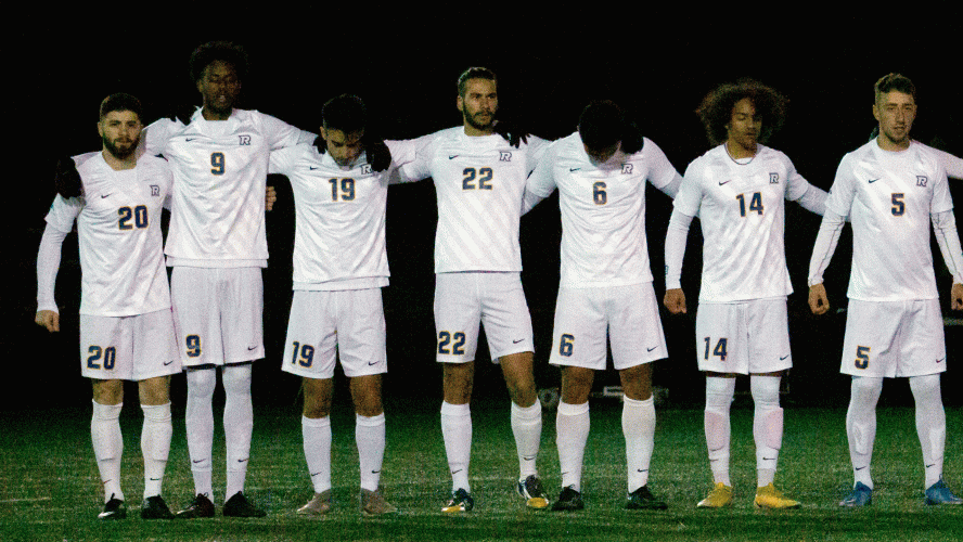 The Rams men's soccer team huddle before the game