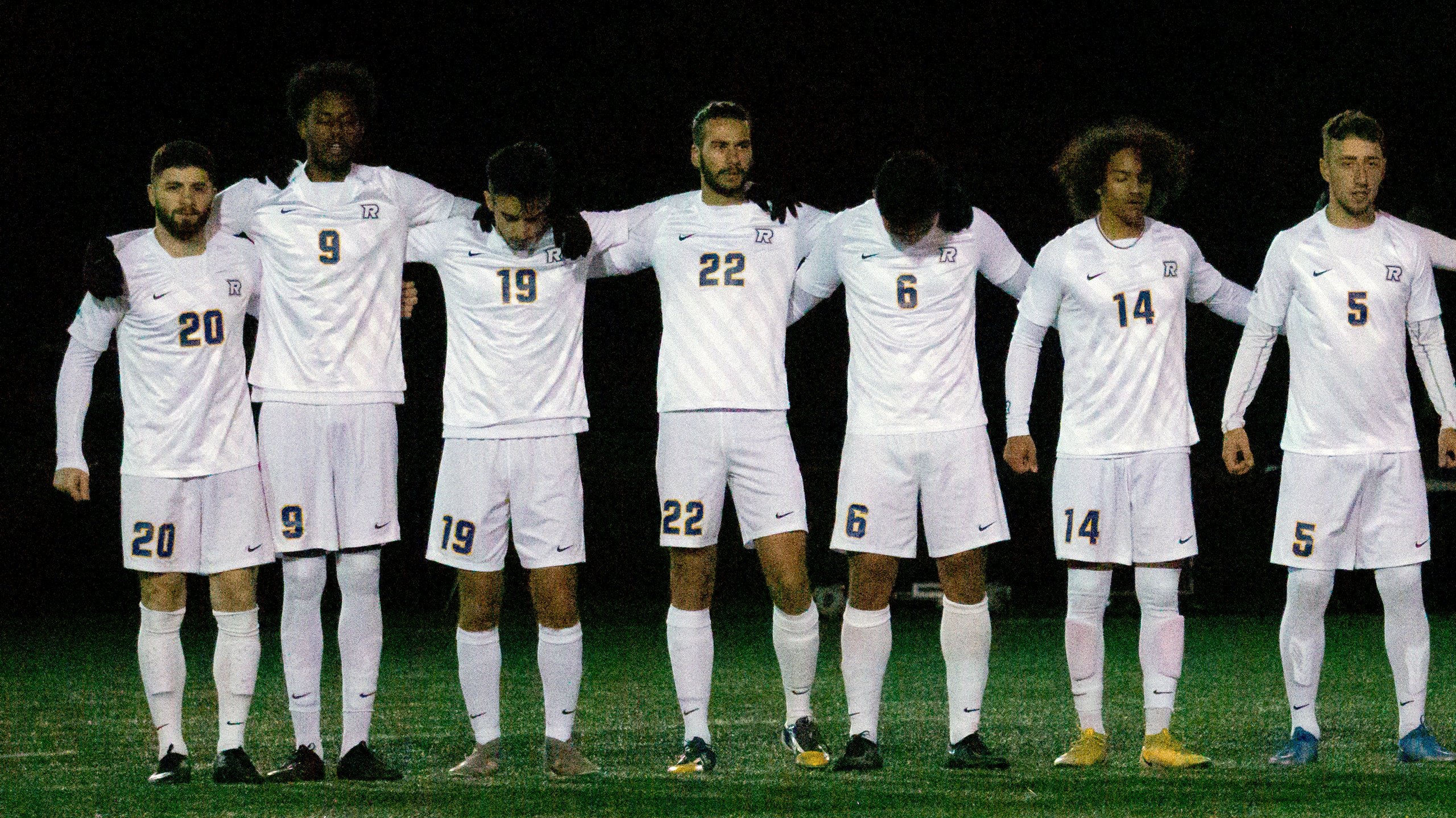 The Rams men's soccer team huddle before the game