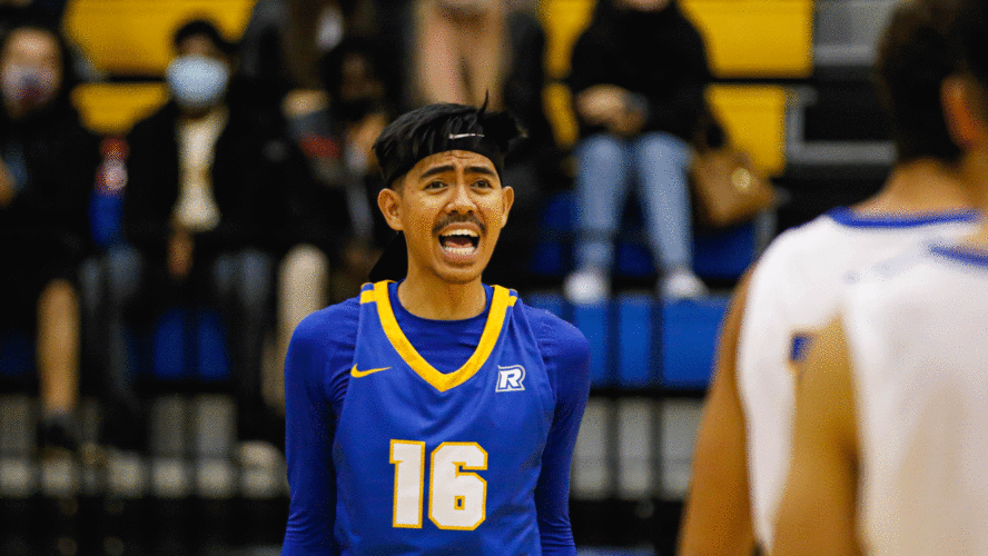 A Rams men's volleyball player in a blue jersey