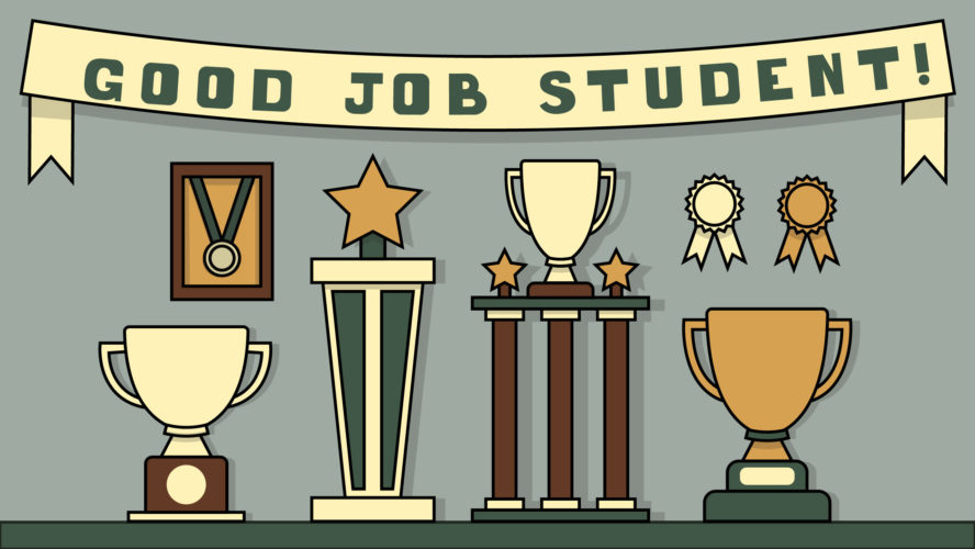 A bunch of trophies and a banner that says "good job student!"