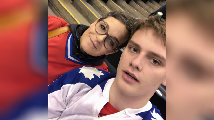 Annie Bergeron, left, wearing a red Montreal Canadiens jersey and Olivier Dundas, right, wearing a blue and white Toronto Maple Leafs jersey