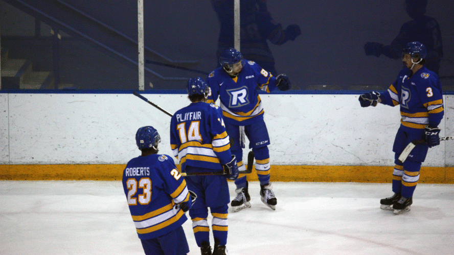 A group of Rams men's hockey players celebrate a goal