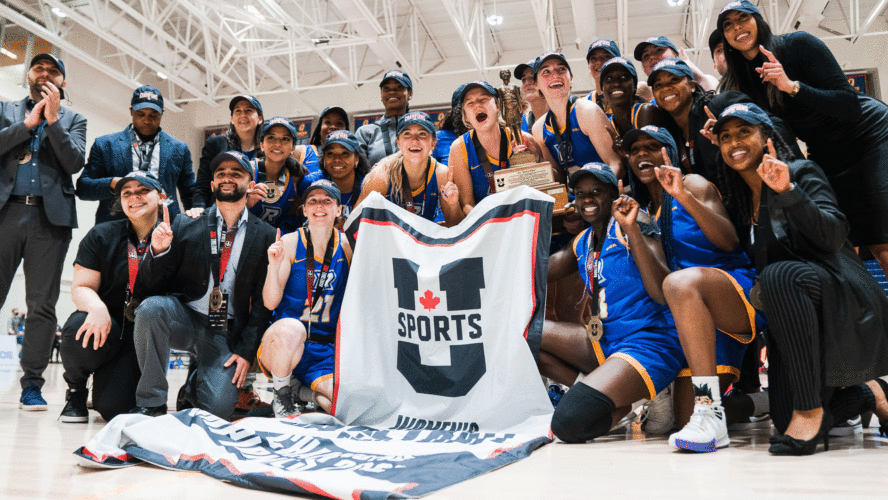 The Rams women's basketball team celebrate winning a national title
