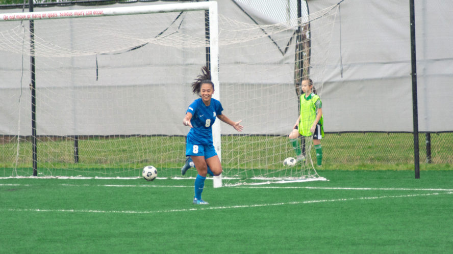 A TMU Bold women's soccer player celebrates after scoring a goal