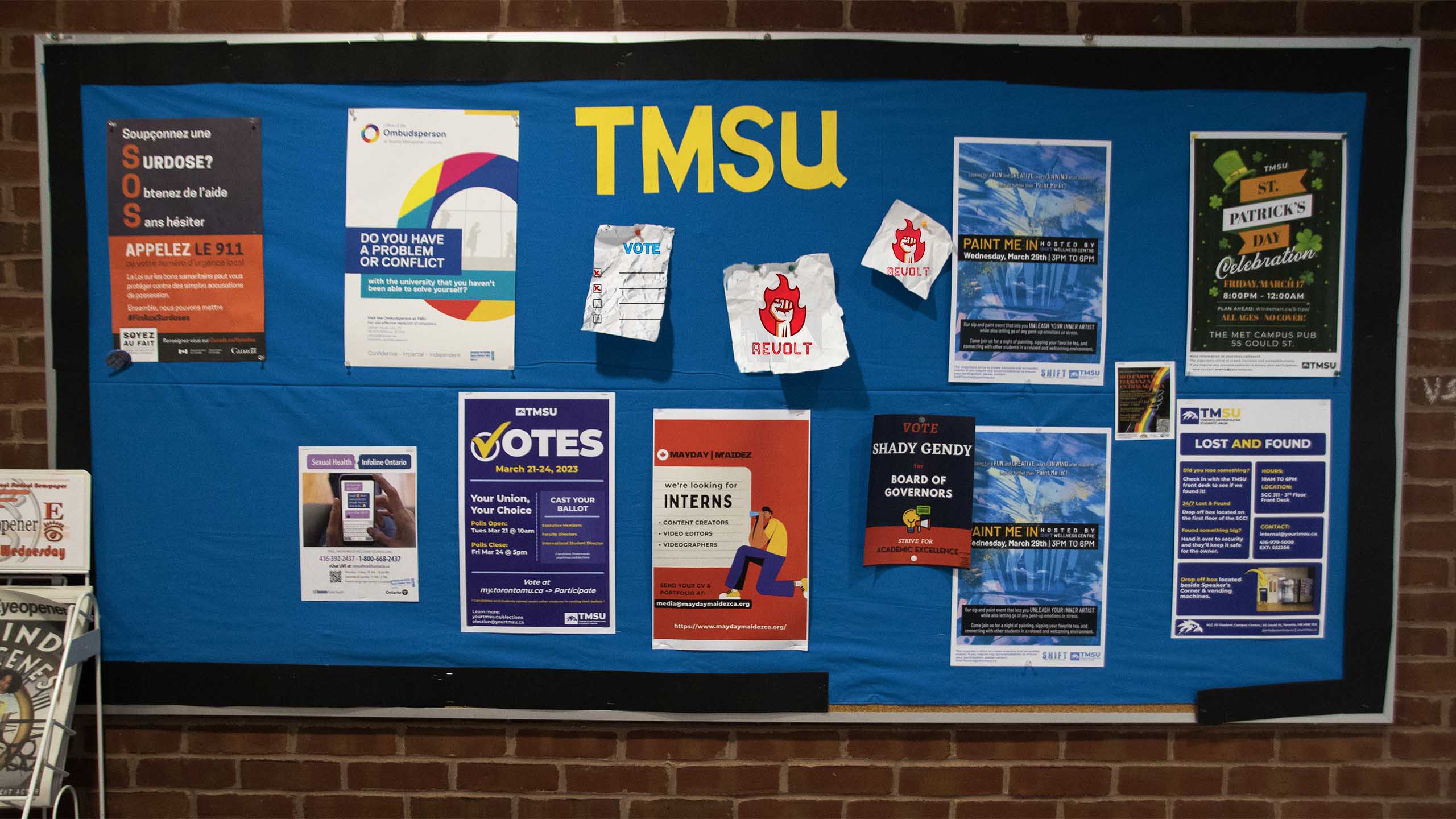 Bulletin board with "TMSU" spelt out and a variety of posters