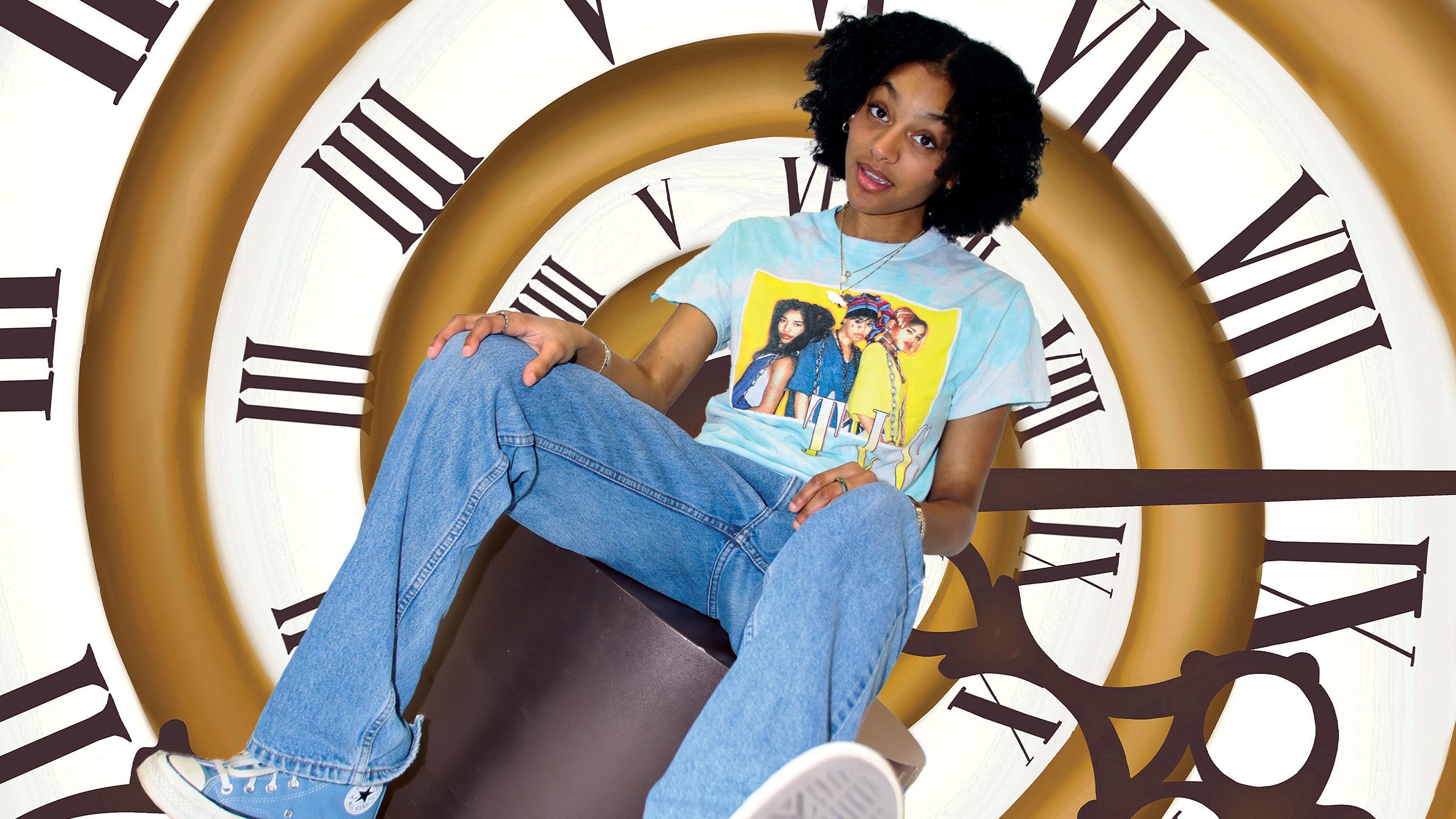 an image of shaylin sitting with a spiraling clock behind her