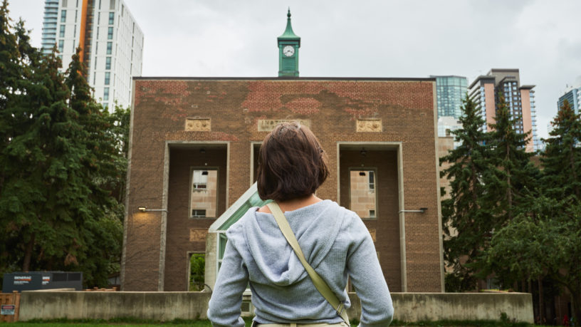 A student stands in front of Toronto Metropolitan University’s (TMU) Campus.