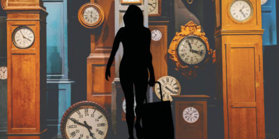 silhouette of person with suitcase walking in front of clocks