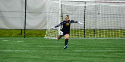 TMU Bold women's soccer goalkeeper Elisa Paolucci kicks the soccer ball from the net