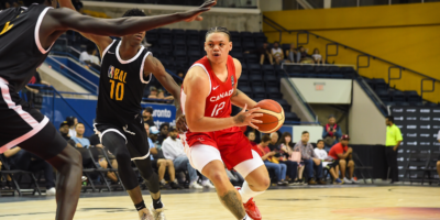 Team Canada player Aaron Rhooms holds a basketball