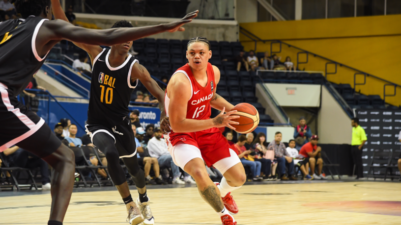 Team Canada player Aaron Rhooms holds a basketball