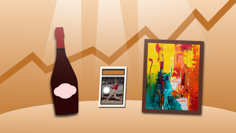Wine bottle, sports card and paining with spotlights shining on the items