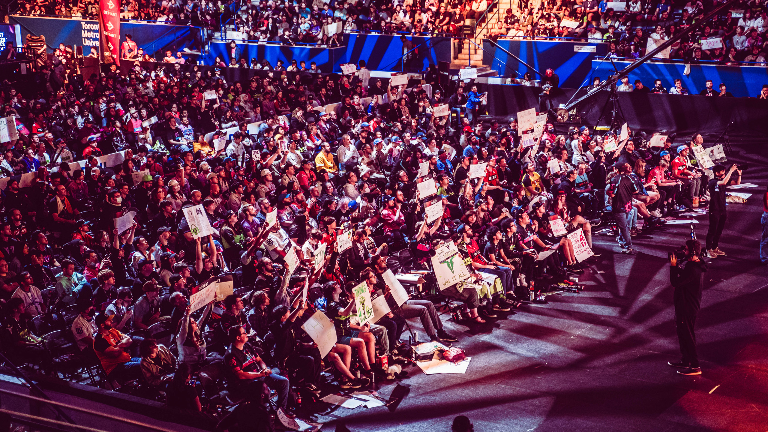 Esports fans sit in stands watching the Overwatch League