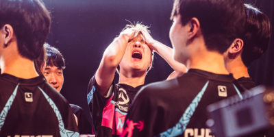 A Flordia Mayhem esports player holds his head in shock after winning the Overwatch League Grand Finals
