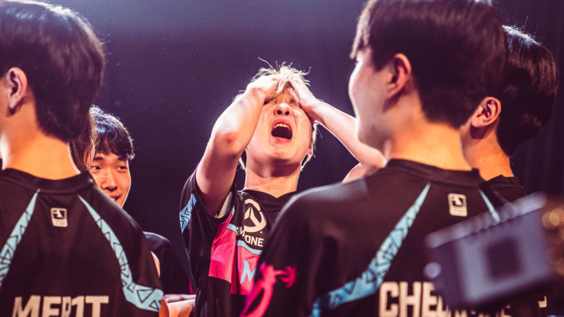 A Flordia Mayhem esports player holds his head in shock after winning the Overwatch League Grand Finals
