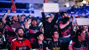 Fans hold up signs inside the Mattamy Athletic Centre