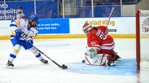 TMU Bold women's hockey player Kayla Kondo sets up for a goal