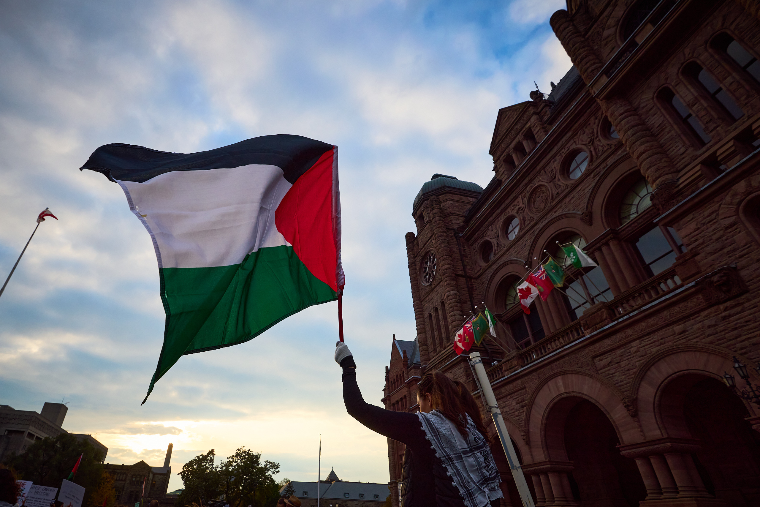 A Palestine flag waved outside Queen's park
