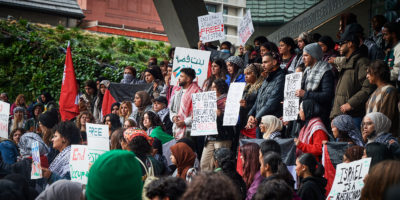 TMU Students hold signs at a rally outside Toronto Metropolitan University