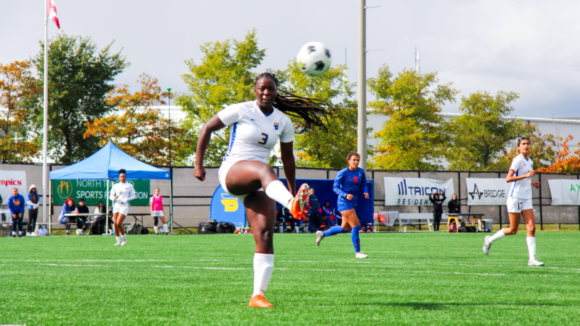 TMU Bold women's soccer player Aalayah Lully kicks a soccer ball