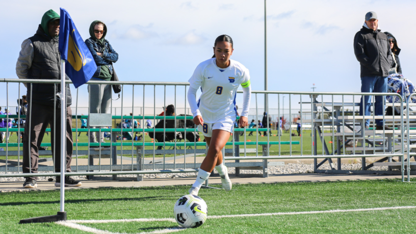 TMU Bold women's soccer player Ivymae Perez kicks a soccer ball at Downsview Park