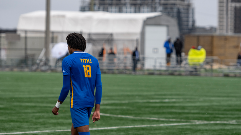 TMU Bold men's soccer player Josiah Lorray on a soccer field
