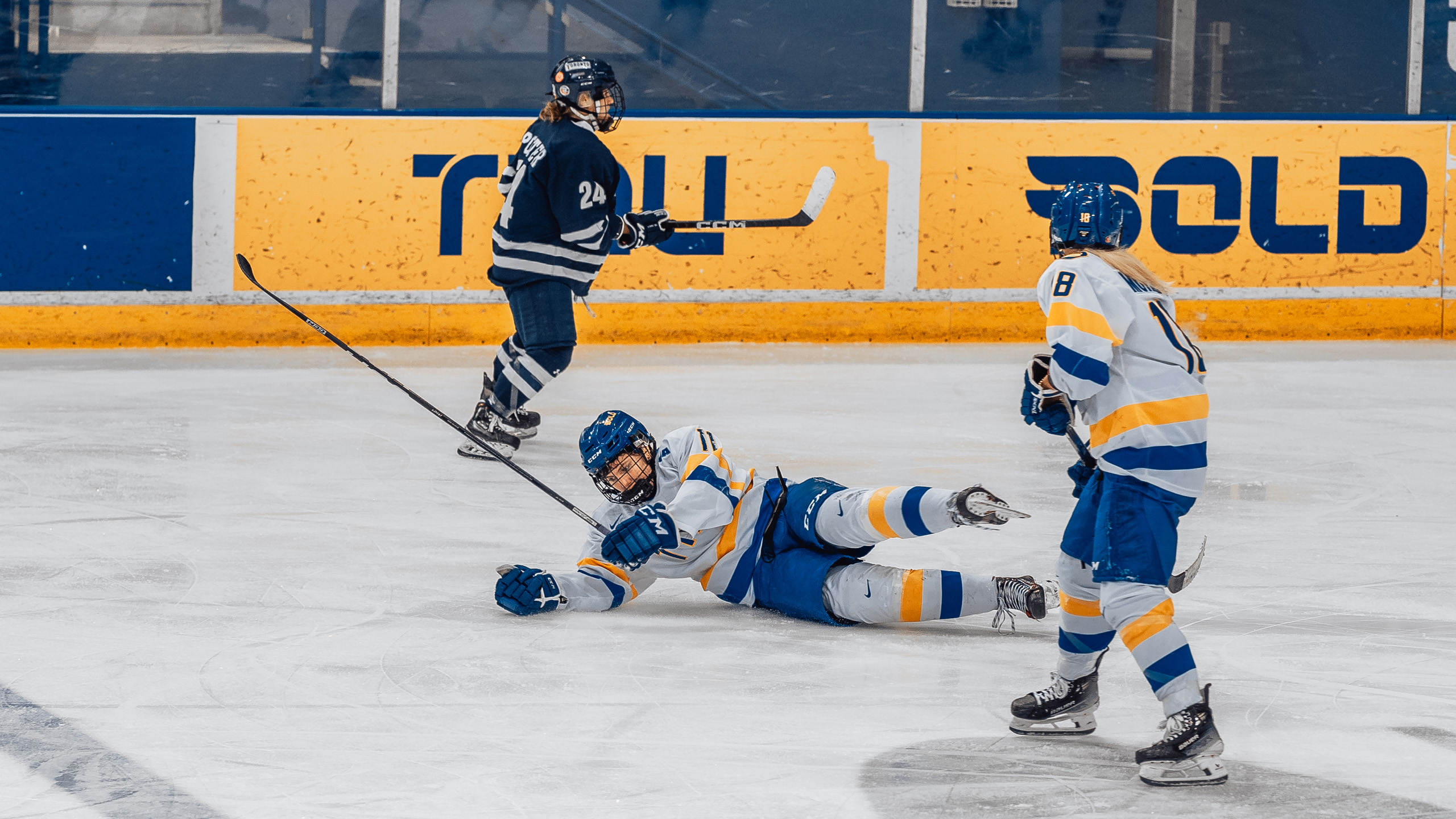 TMU women's hockey player Gaby Gareau falls on the ice