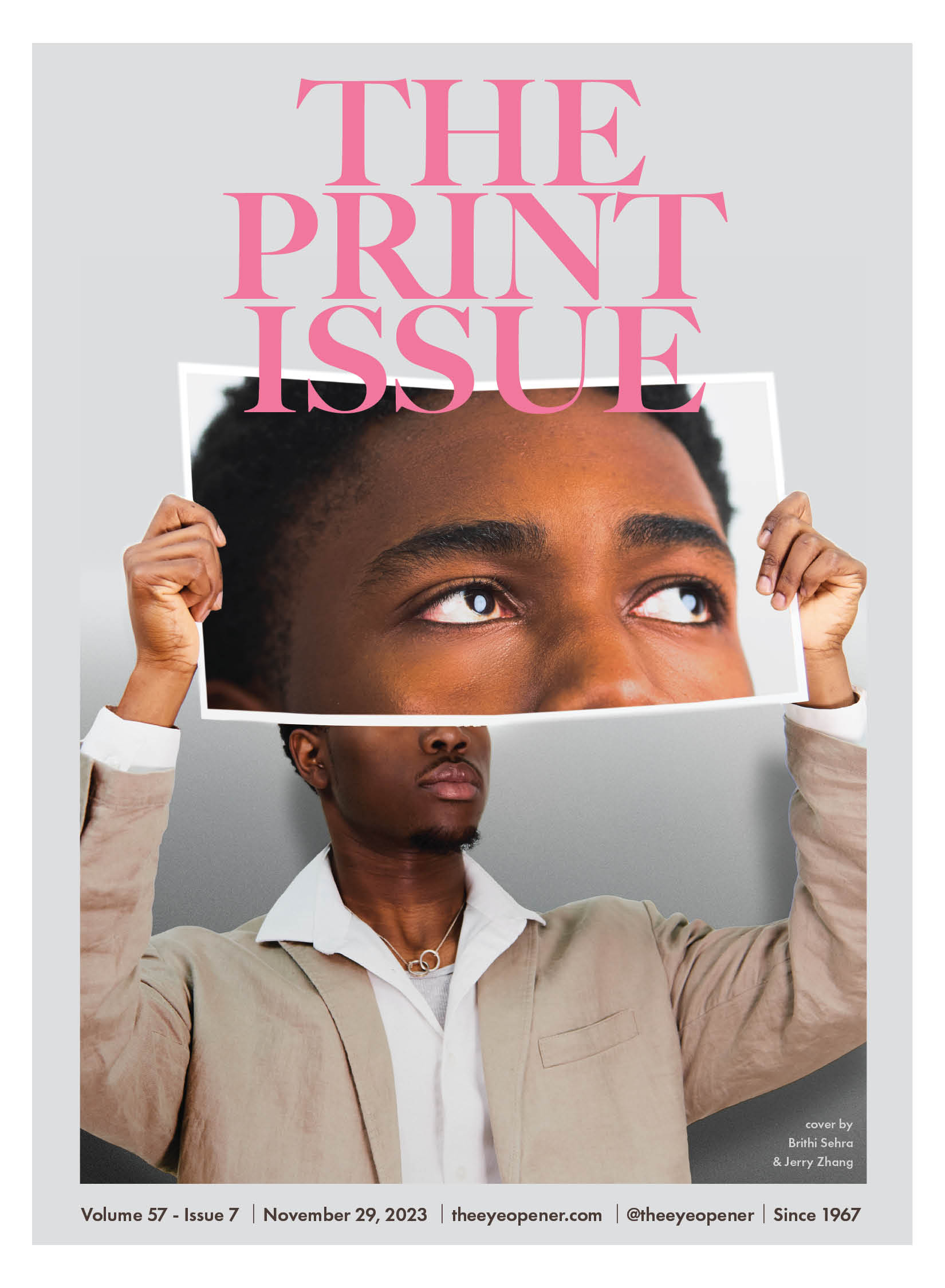 The print issue cover. Photo of a man holding up a printed photo of his eyes.