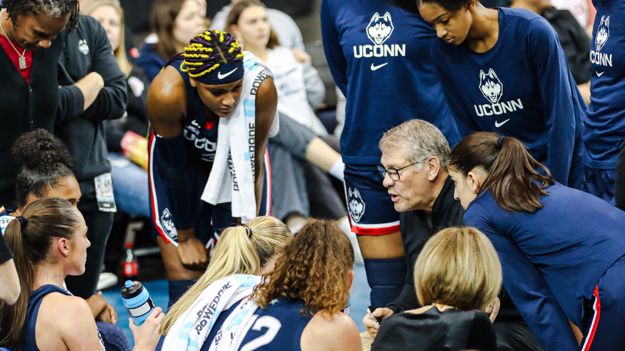 UConn Huskies women's basketball head coach Geno Auriemma talks to his team during a timeout