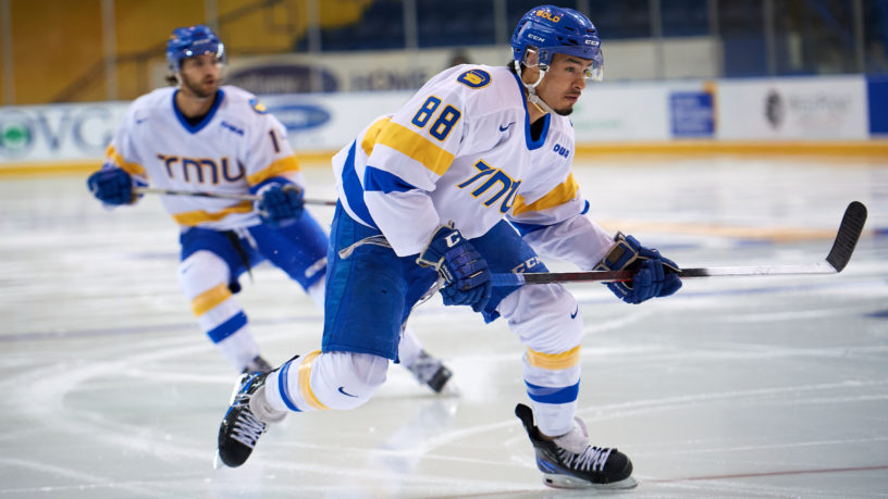 TMU men's hockey player Kyle Bollers skates on the ice
