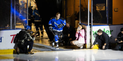 Toronto PWHL player Emma Keenan skates onto the ice in pre-game player introductions