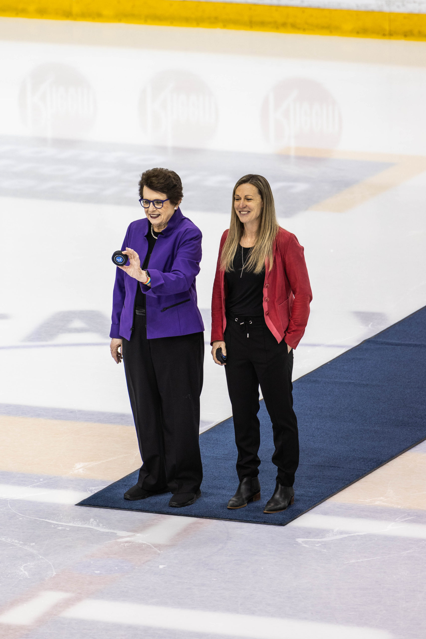 Billie Jean King and Jayna Hefford prepare to drop the puck at the ceremonial face-off