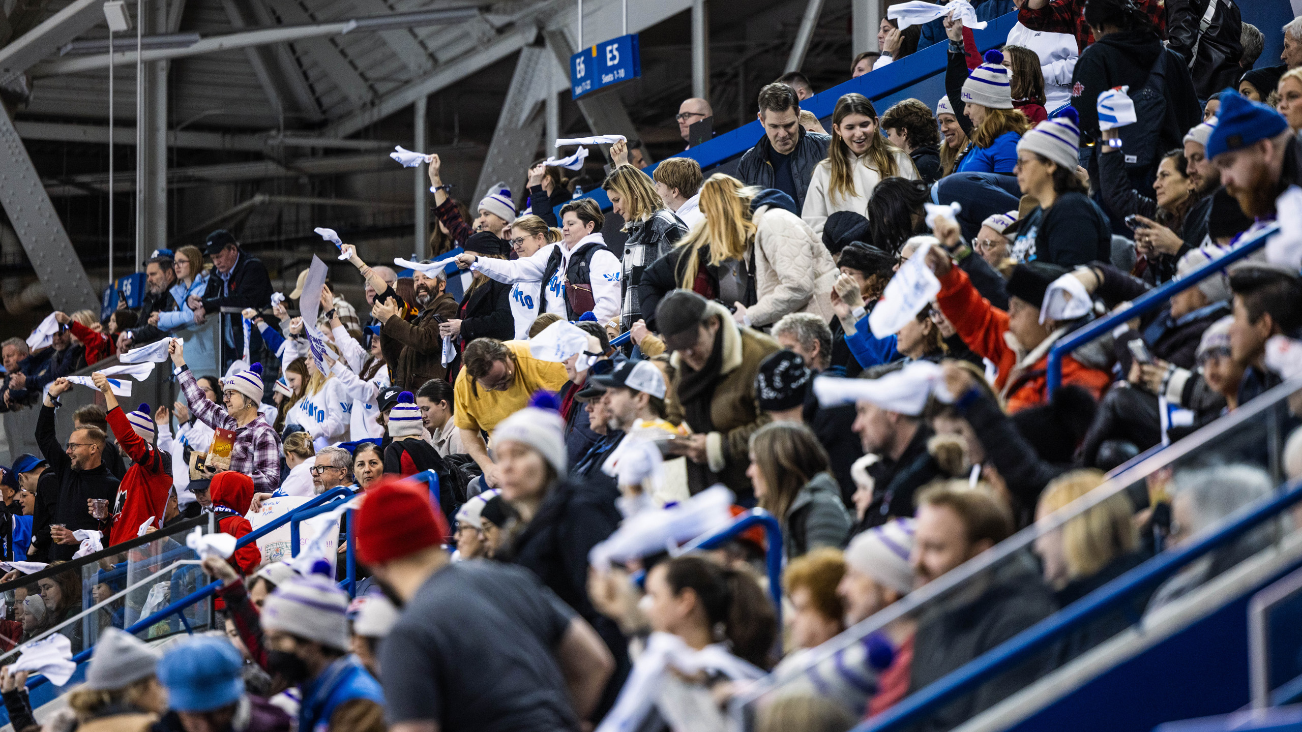 The crowd at the MAC wave towels cheer on Toronto at the PWHL game
