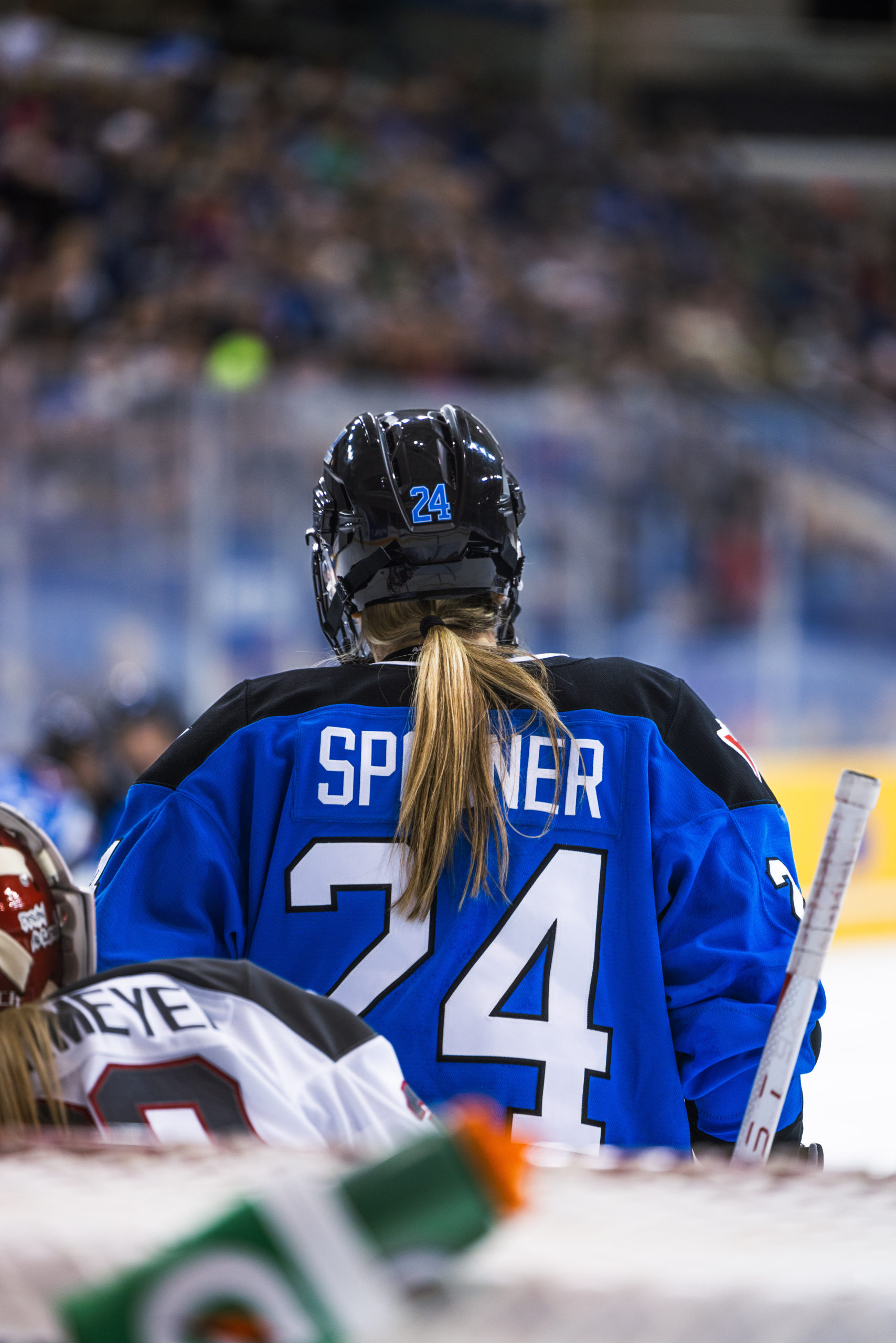PWHL Toronto player Natalie Spooner stands right in front of the PWHL Ottawa net