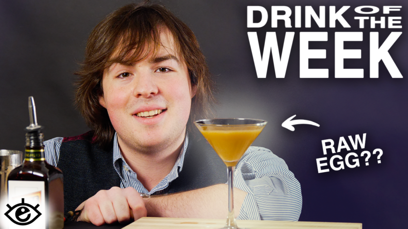 Jake MacAndrew leaning against a table with a martini glass in front of him. An arrow pointing to the glass with the caption “Raw egg?” Title reads: Drink of the week.