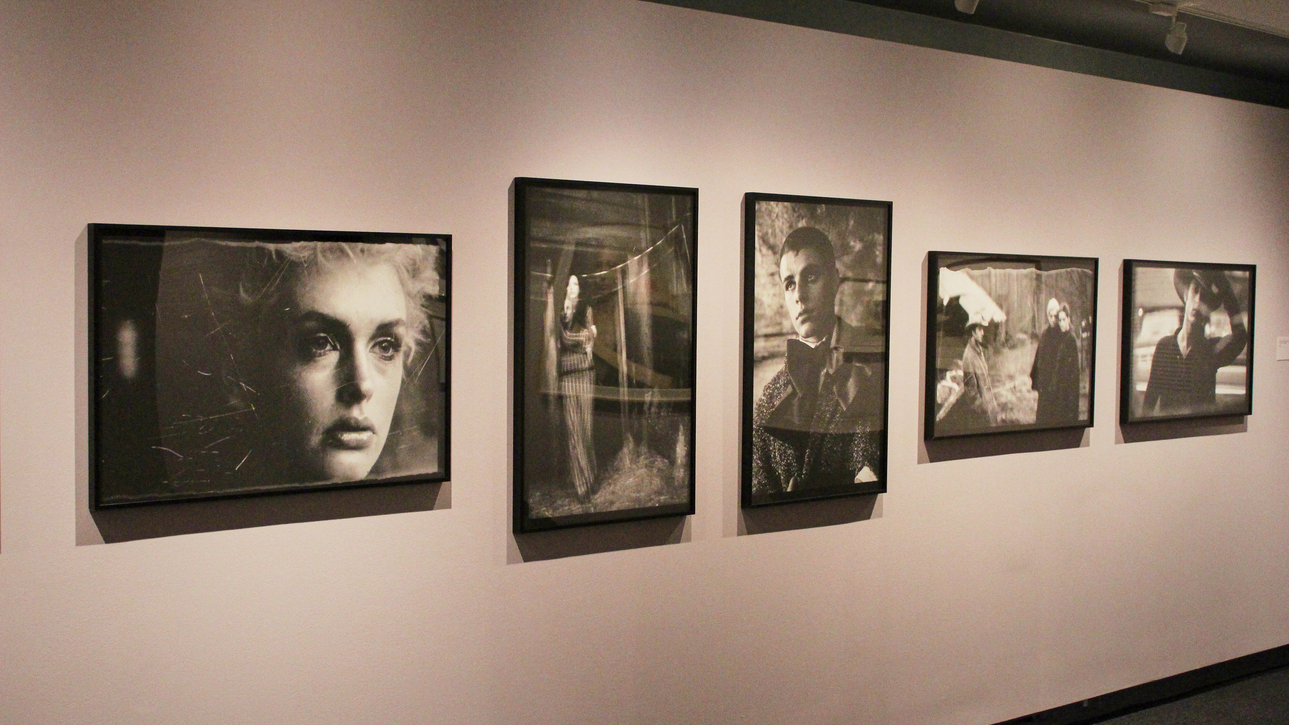 artistic photos hand on the wall at the "Other Worldly" exhibit at TMU's Image Arts building