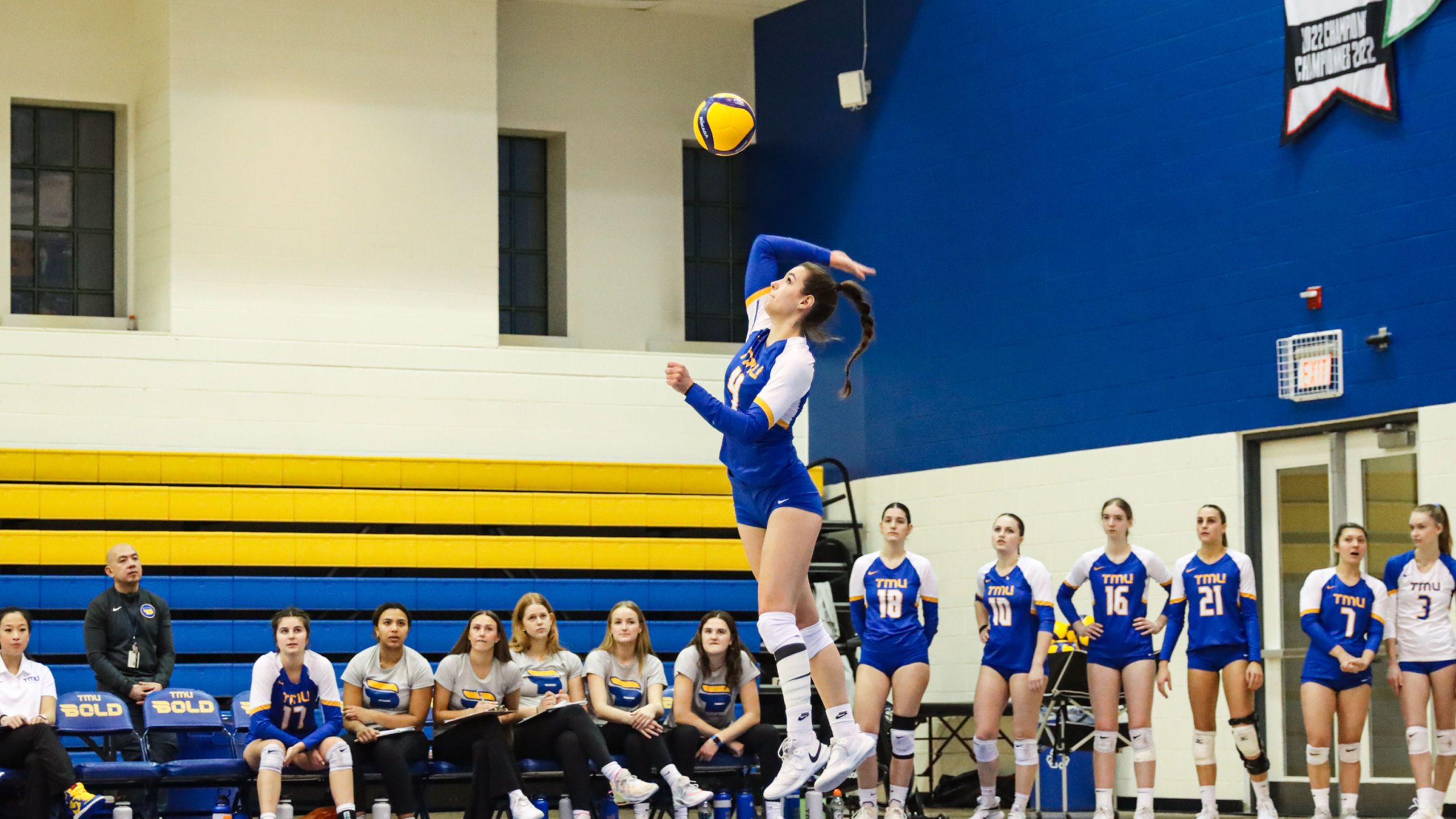 TMU Bold women's volleyball player Mikayla Sherriffs serves the ball